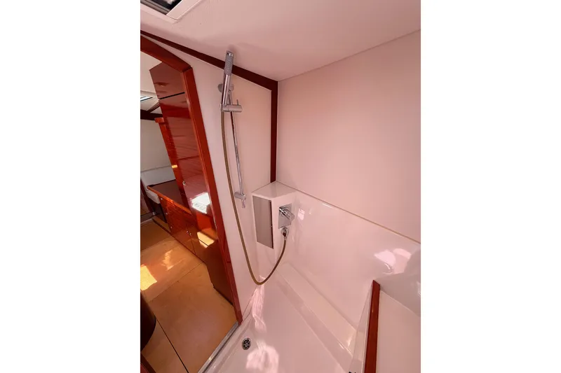 Slide: The Image of Interior of 2006 Hanse 461 yacht featuring a modern shower area with wooden accents. - 69