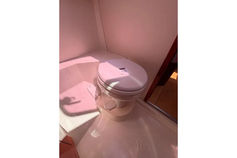 Slide: The Image of Toilet in 2006 Hanse 461 yacht bathroom, illuminated by natural light. - 70