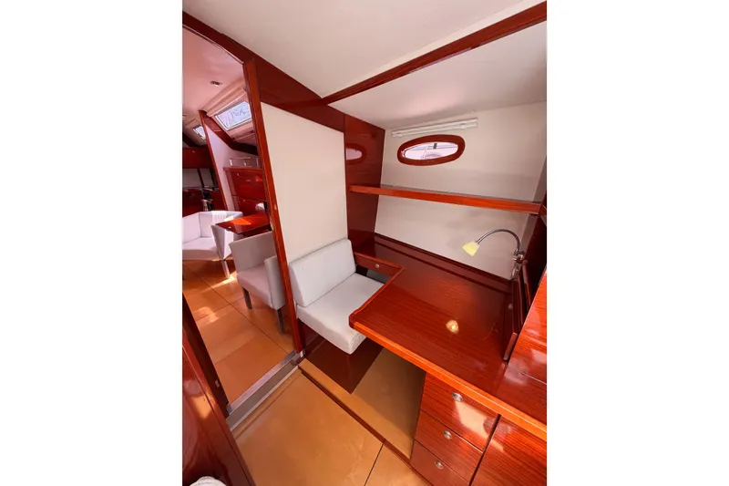 Slide: The Image of Interior of 2006 Hanse 461 yacht with wooden finish and seating area. - 74
