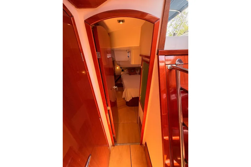 Slide: The Image of Interior view of 2006 Hanse 461 yacht cabin with polished wood finish. - 80