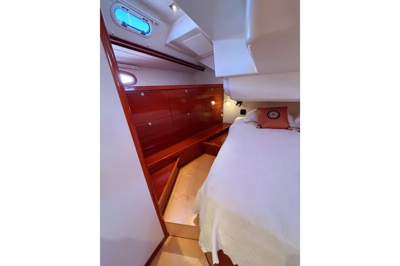Slide: The Image of Luxurious cabin interior of 2006 Hanse 461 yacht with wooden cabinetry and cozy bedding. - 83