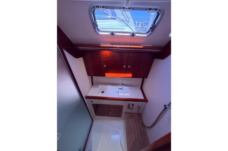 Slide: The Image of Bathroom interior of 2006 Hanse 461 yacht with wooden cabinetry and skylight. - 88