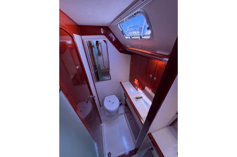 Slide: The Image of Luxurious bathroom interior of 2006 Hanse 461 yacht with modern fixtures and skylight. - 89