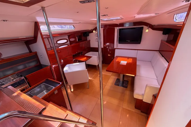 Slide: The Image of Luxurious 2006 Hanse 461 yacht interior with modern kitchen, dining area, and cozy seating. - 91