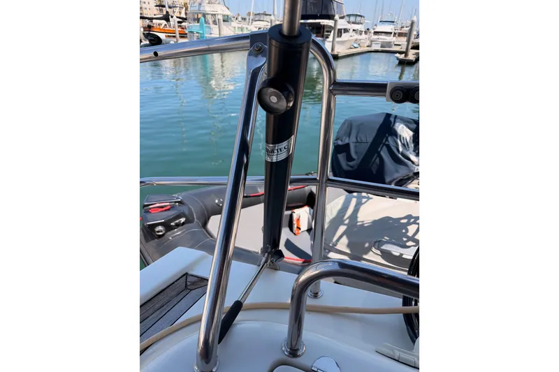 Slide: The Image of Close-up of 2006 Hanse 461 yacht's steering area with marina background. - 92