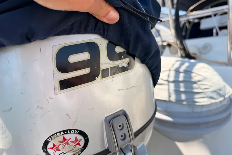 Slide: The Image of Outboard motor with "9.9" label on a 2006 Hanse 461 sailboat. - 93