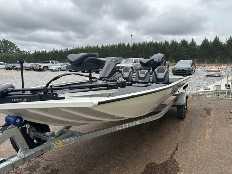 Slide: The Image of 2026 Lowe Stinger ST175 90HP boat on trailer, cloudy sky. - 3