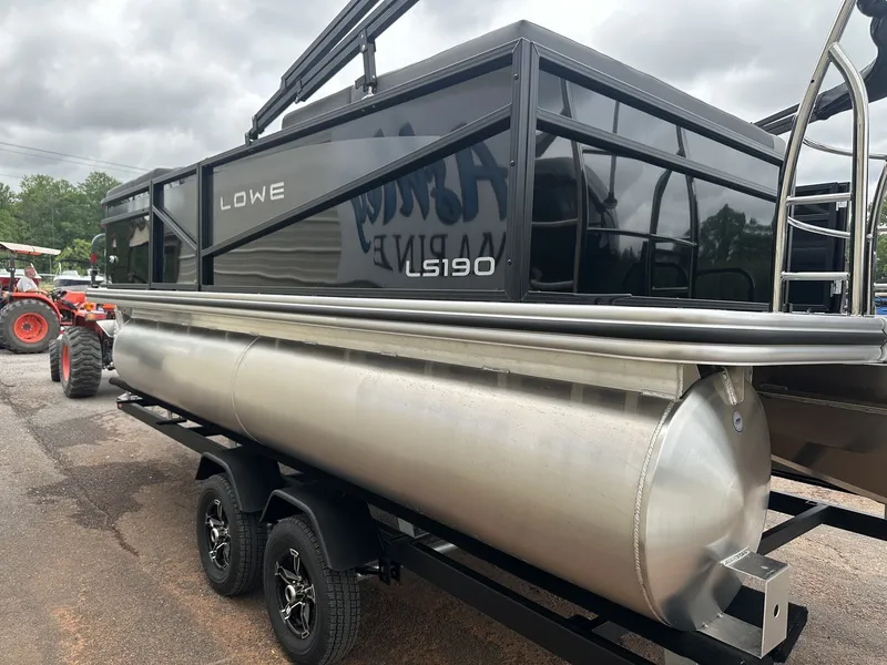 Slide: The Image of 2026 Lowe LS Walk Thru 190 pontoon boat on trailer. - 8