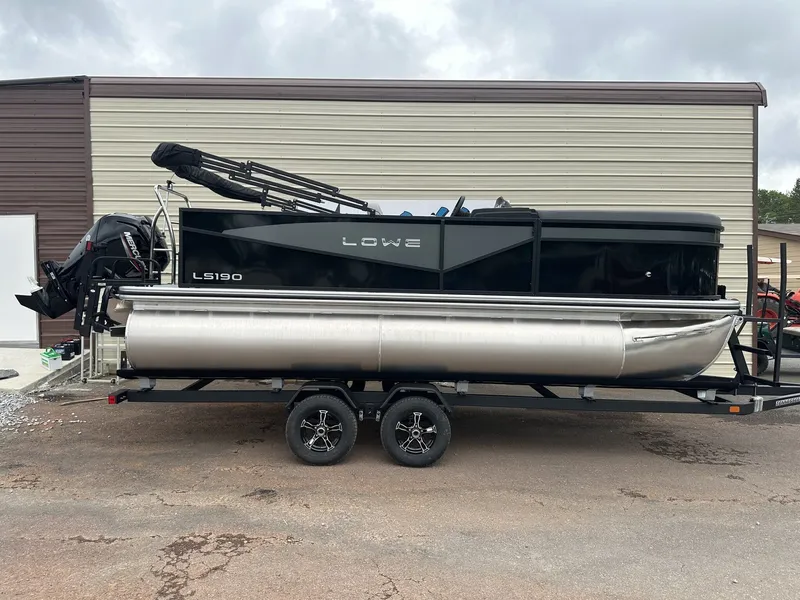 The Image of Lowe LS Walk Thru 190 pontoon boat, 2026 model, on trailer. - 1