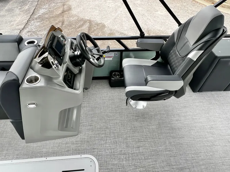 Slide: The Image of Interior of Avalon Venture 85 25' with helm console and seat. - 13