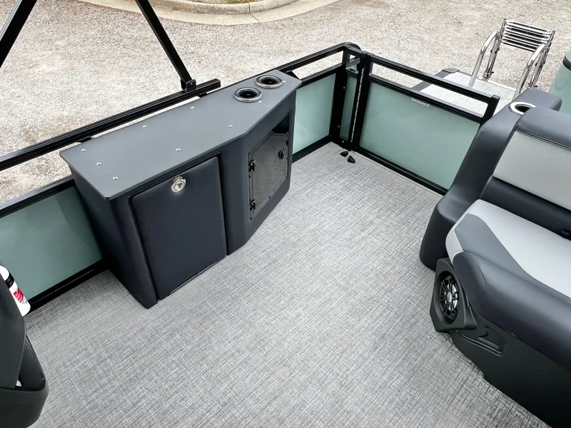 Slide: The Image of Interior of Avalon Venture 85 25' pontoon boat, gray flooring, bench seating. - 15