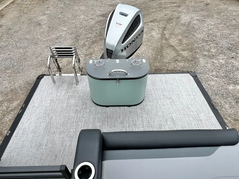 Slide: The Image of 2026 Avalon Venture 85 pontoon boat with Honda motor, rear bench, and storage. - 17