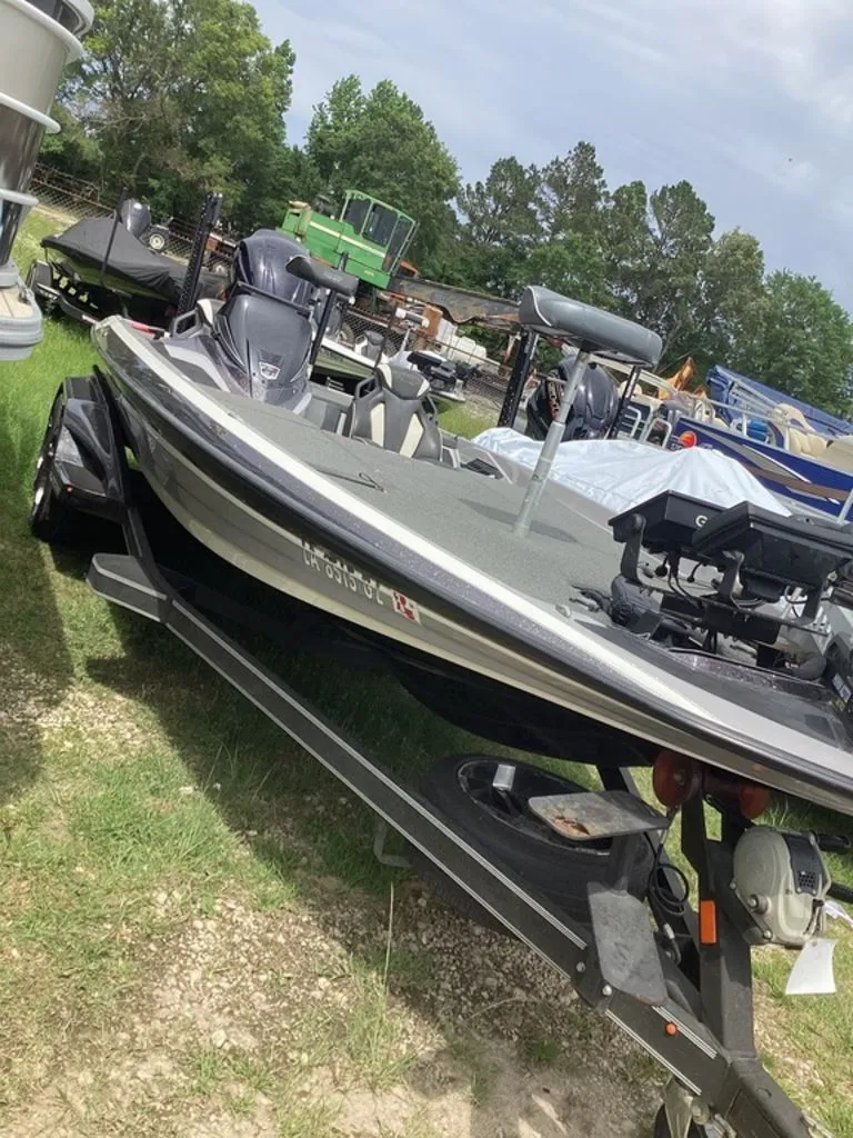 The Image of 2020 Skeeter FXR21 Limited boat parked on trailer outdoors. - 1