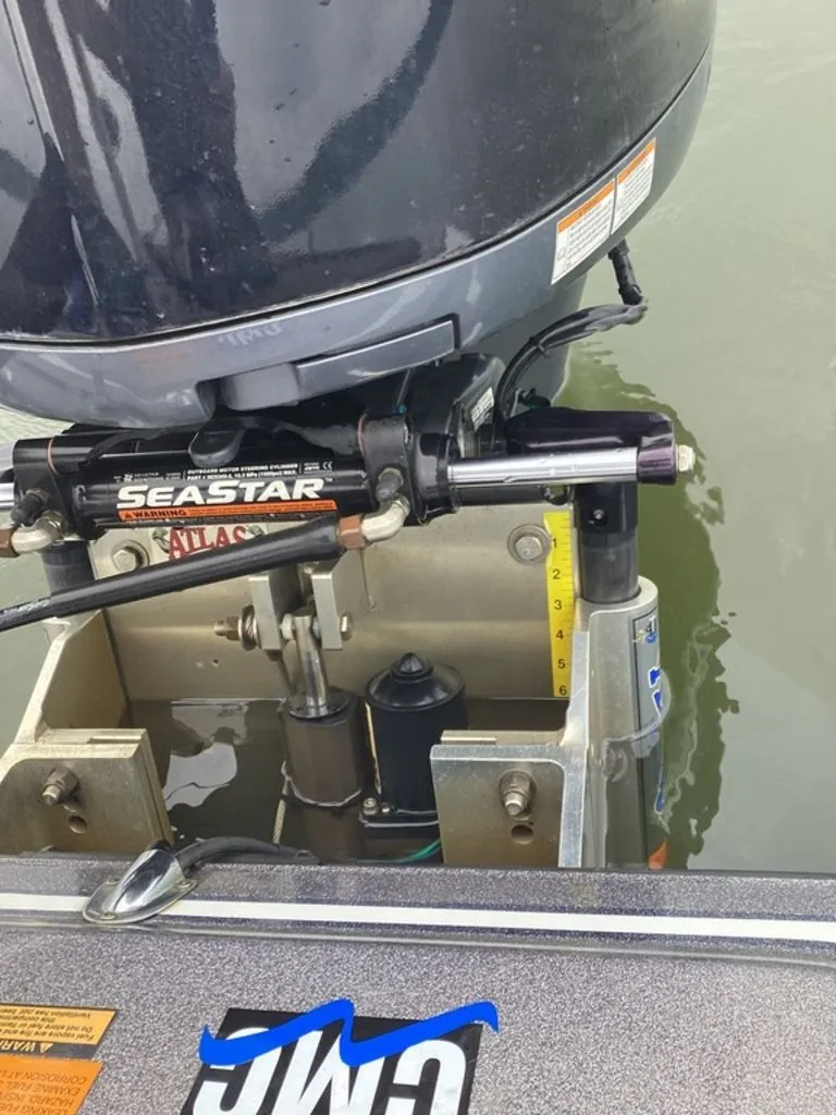 Slide: The Image of Close-up of a 2017 Skeeter ZX250 boat stern with SeaStar hydraulics. - 15
