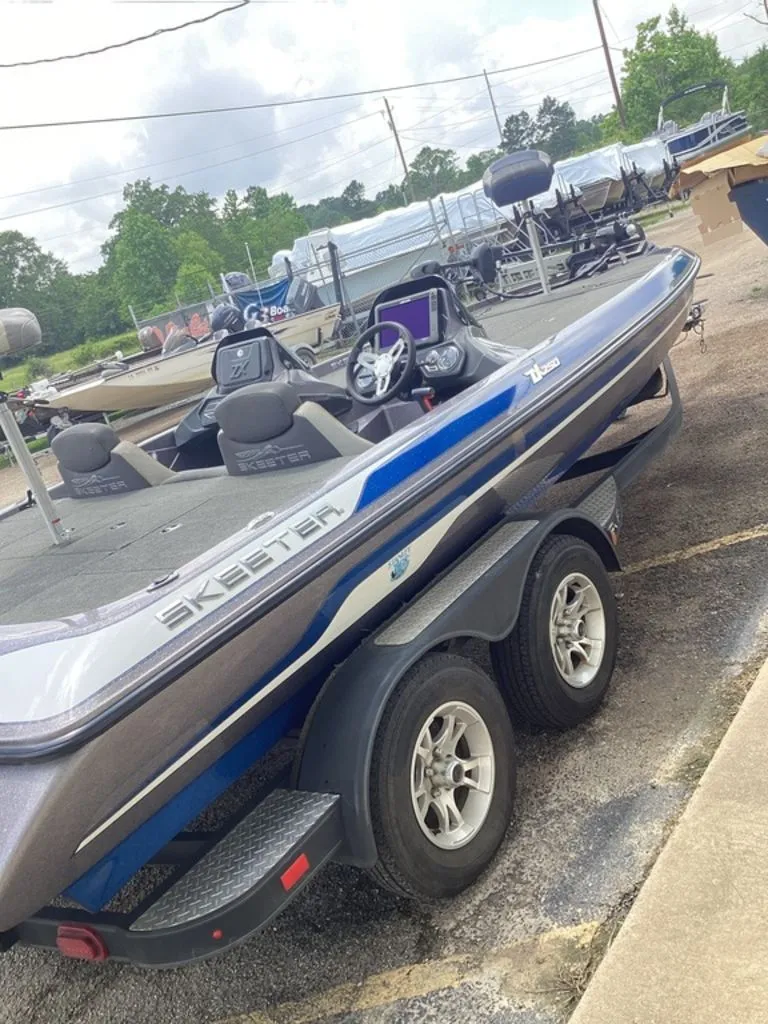 Slide: The Image of 2017 Skeeter ZX250 boat parked on trailer outdoors. - 3