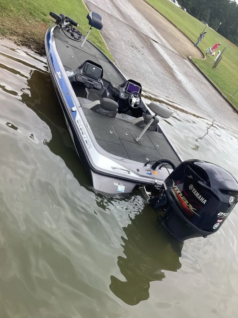 Slide: The Image of 2017 Skeeter ZX250 boat in water near shore. - 31