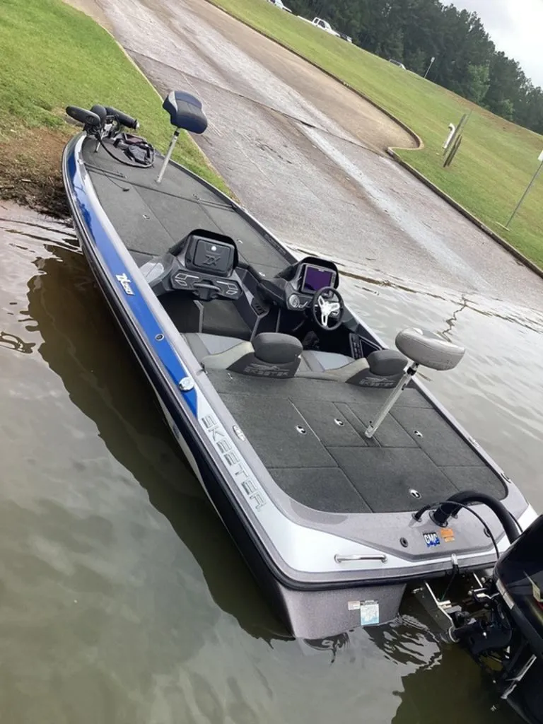Slide: The Image of 2017 Skeeter ZX250 bass boat at a boat ramp. - 32