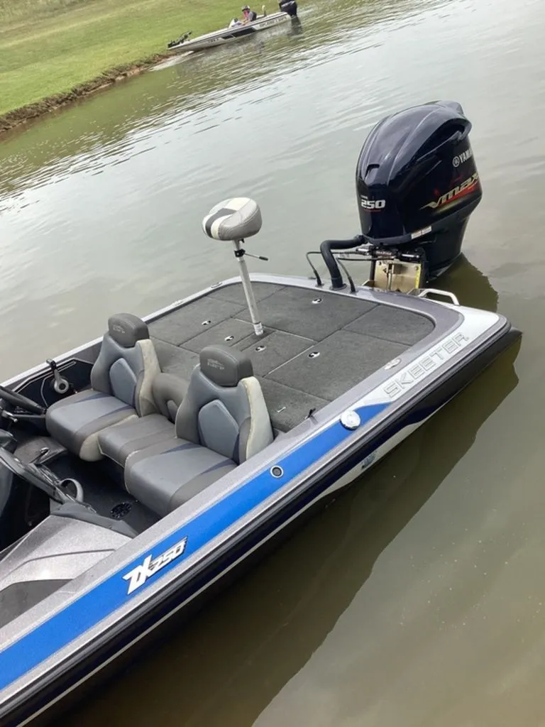 Slide: The Image of 2017 Skeeter ZX250 boat on calm water with Yamaha engine. - 34