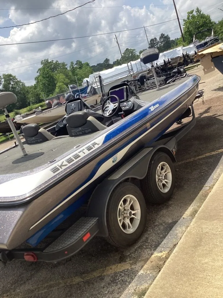 Slide: The Image of 2017 Skeeter ZX250 boat parked on trailer outdoors. - 40