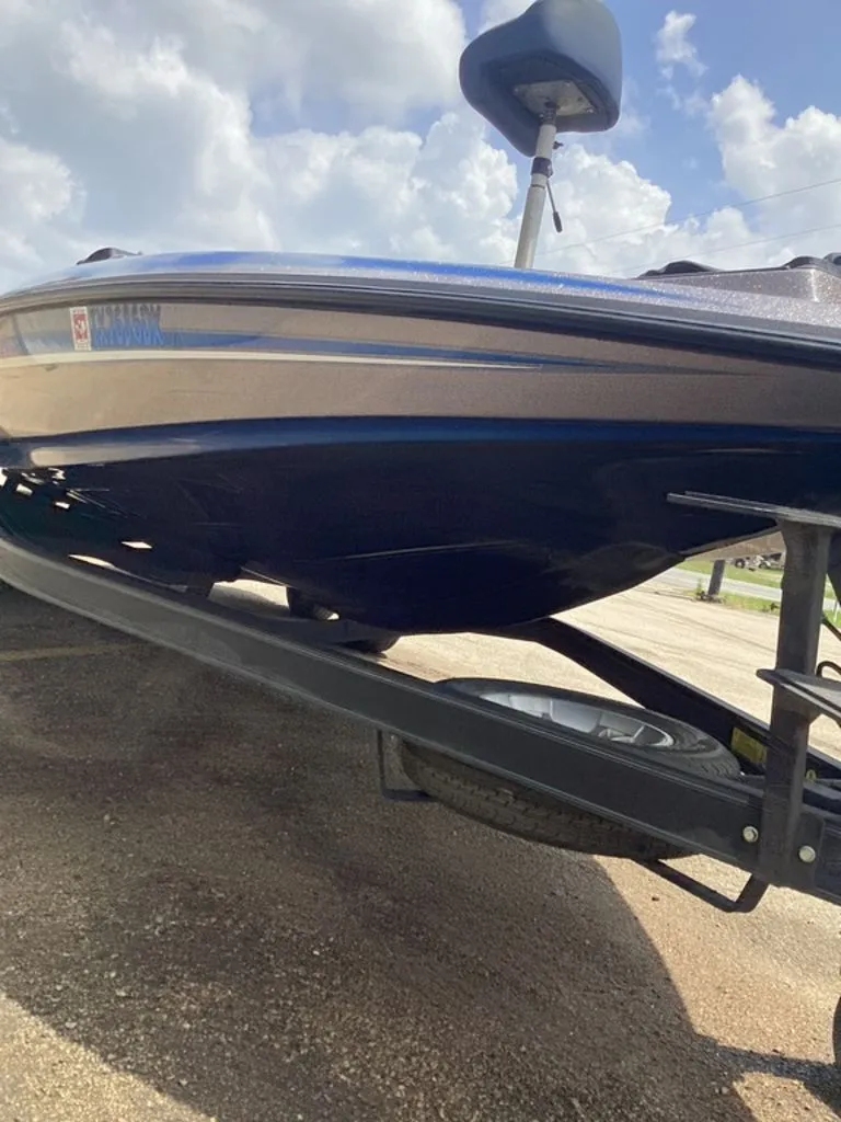 Slide: The Image of 2017 Skeeter ZX250 boat on trailer under blue sky. - 45