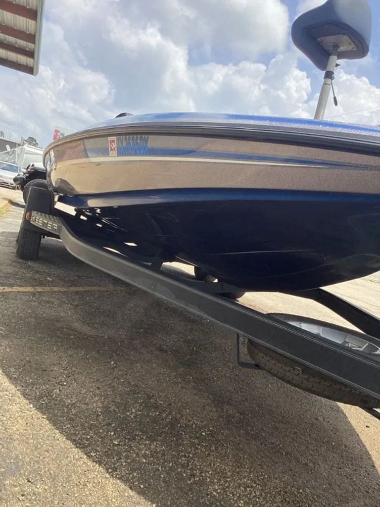 Slide: The Image of 2017 Skeeter ZX250 boat on trailer under cloudy sky. - 46