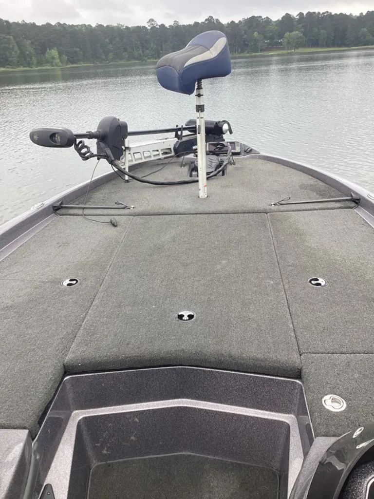 Slide: The Image of 2017 Skeeter ZX250 boat on a calm lake. - 8
