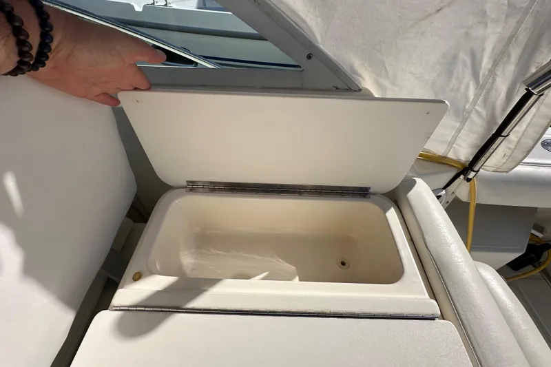 Slide: The Image of Open storage compartment on a 1998 Tiara Yachts 2900 Coronet boat. - 12