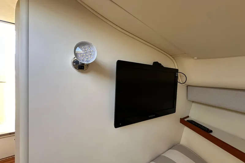 Slide: The Image of Interior of 1998 Tiara Yachts 2900 Coronet with wall-mounted TV and LED light. - 23