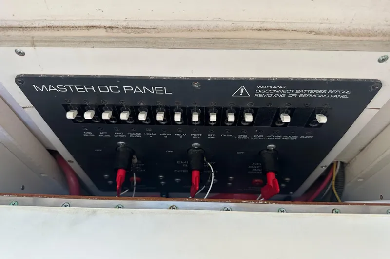 Slide: The Image of Master DC panel on a 1998 Tiara Yachts 2900 Coronet, featuring multiple switches and warning label. - 31