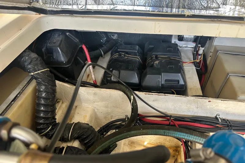 Slide: The Image of Engine compartment of a 1998 Tiara Yachts 2900 Coronet, showing batteries and wiring. - 37