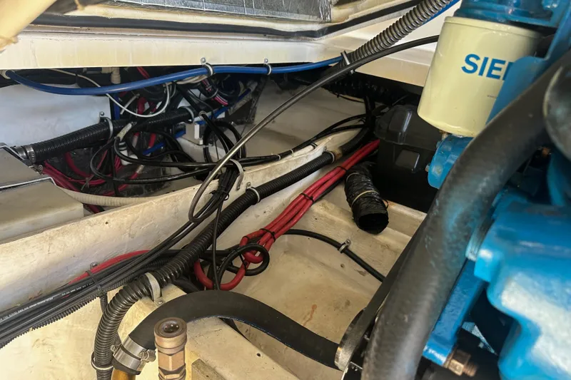 Slide: The Image of Engine compartment of a 1998 Tiara Yachts 2900 Coronet, showcasing wiring and components. - 38