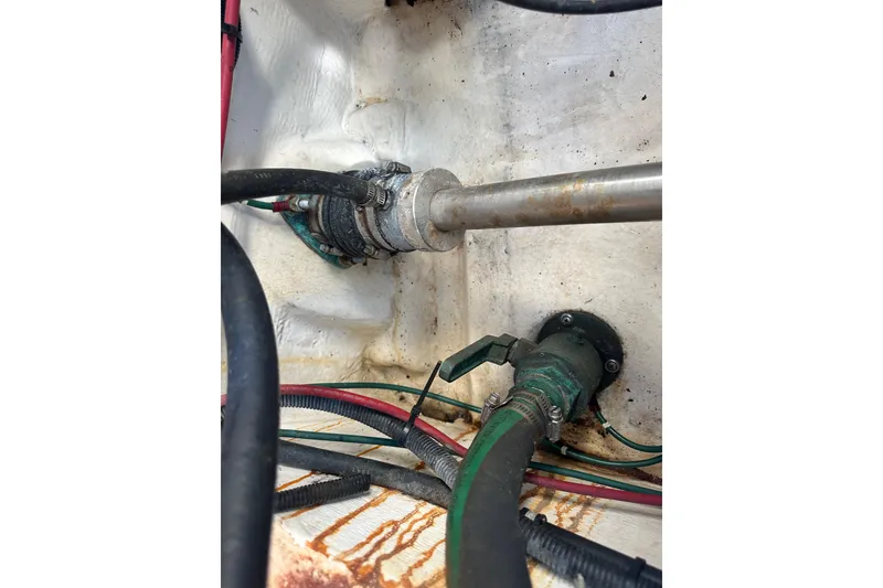 Slide: The Image of Engine compartment of a 1998 Tiara Yachts 2900 Coronet, showing hoses and fittings. - 40