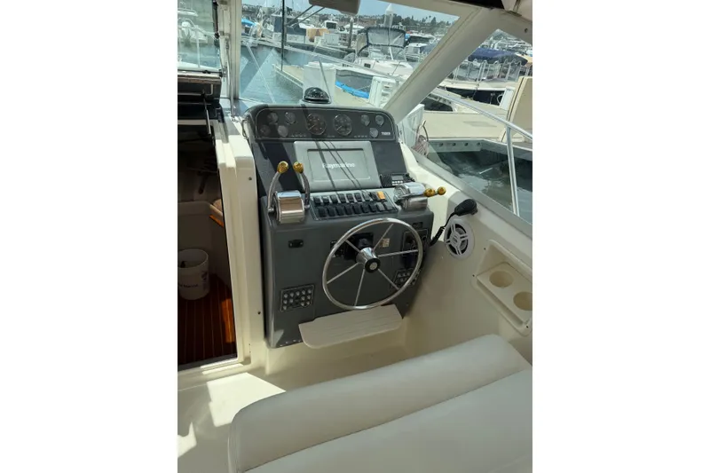 Slide: The Image of 1998 Tiara Yachts 2900 Coronet helm with steering wheel and control panel. - 48
