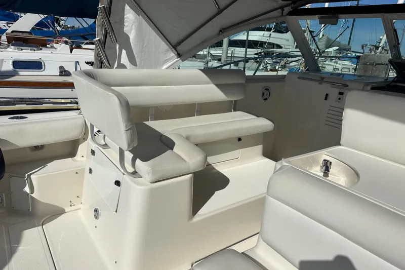 Slide: The Image of 1998 Tiara Yachts 2900 Coronet interior with white seating and nautical details. - 7