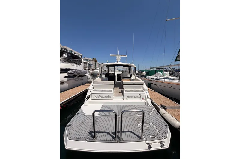 Slide: The Image of 2020 Cruisers Yachts 390 Express Coupe docked at marina, rear view. - 10
