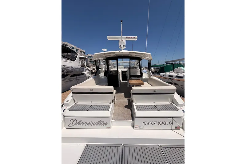 Slide: The Image of 2020 Cruisers Yachts 390 Express Coupe docked in Newport Beach marina. - 13