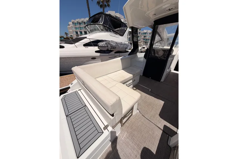 Slide: The Image of 2020 Cruisers Yachts 390 Express Coupe interior with seating and modern design. - 15