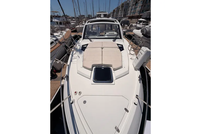 Slide: The Image of 2020 Cruisers Yachts 390 Express Coupe docked in marina, showcasing sleek design. - 25