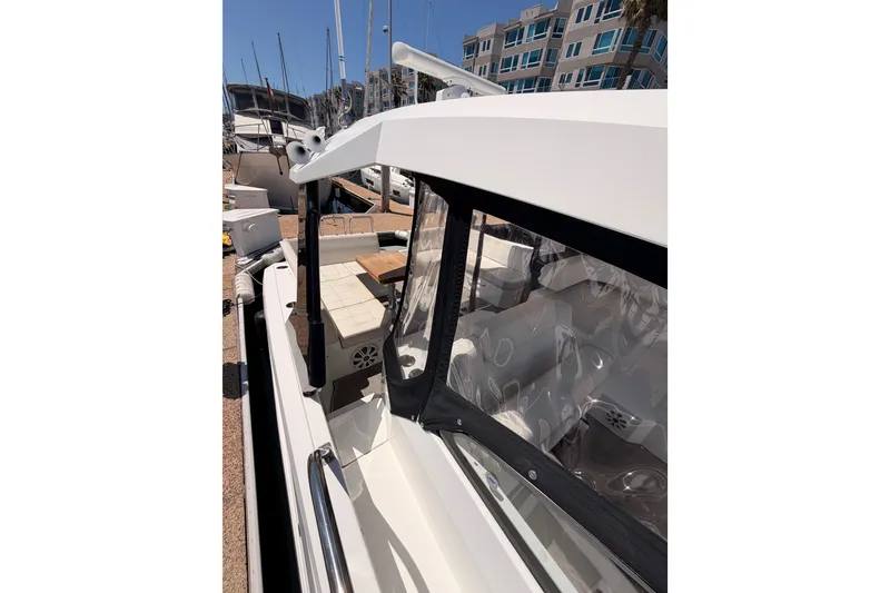 Slide: The Image of 2020 Cruisers Yachts 390 Express Coupe docked, showcasing sleek design and spacious deck. - 27