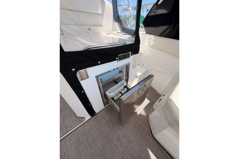 Slide: The Image of 2020 Cruisers Yachts 390 Express Coupe interior with open stainless steel drawer. - 30