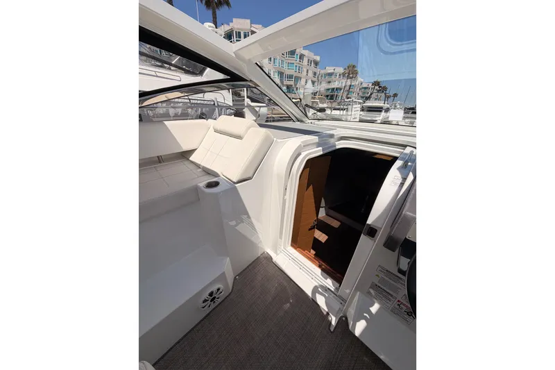 Slide: The Image of 2020 Cruisers Yachts 390 Express Coupe interior with seating and cabin entrance. - 41