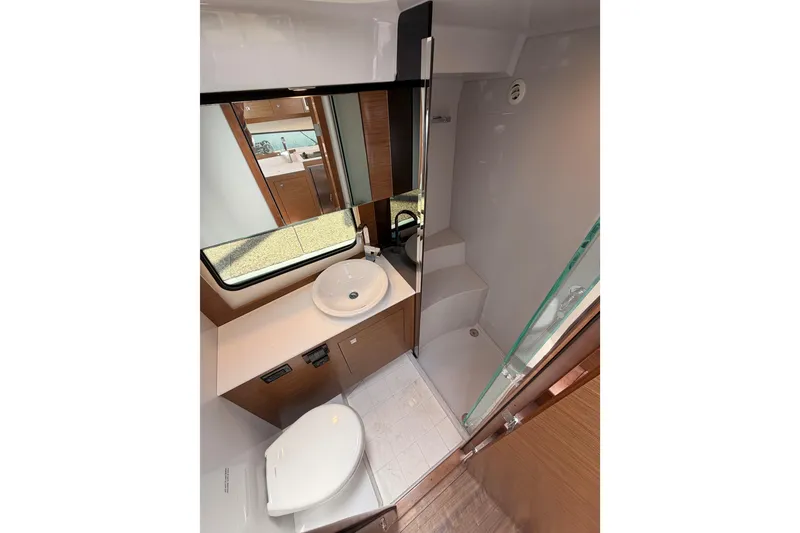 Slide: The Image of Modern bathroom interior of 2020 Cruisers Yachts 390 Express Coupe with sink and shower. - 51