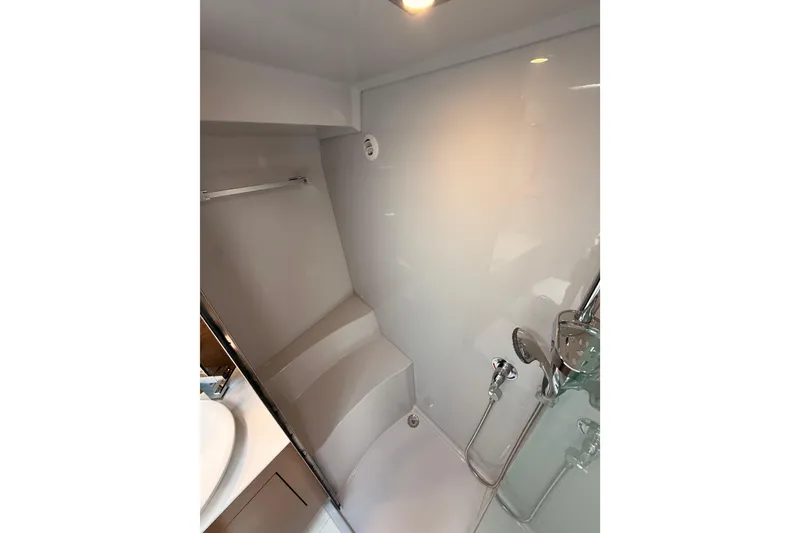 Slide: The Image of Bathroom interior of 2020 Cruisers Yachts 390 Express Coupe with modern shower fixtures. - 54