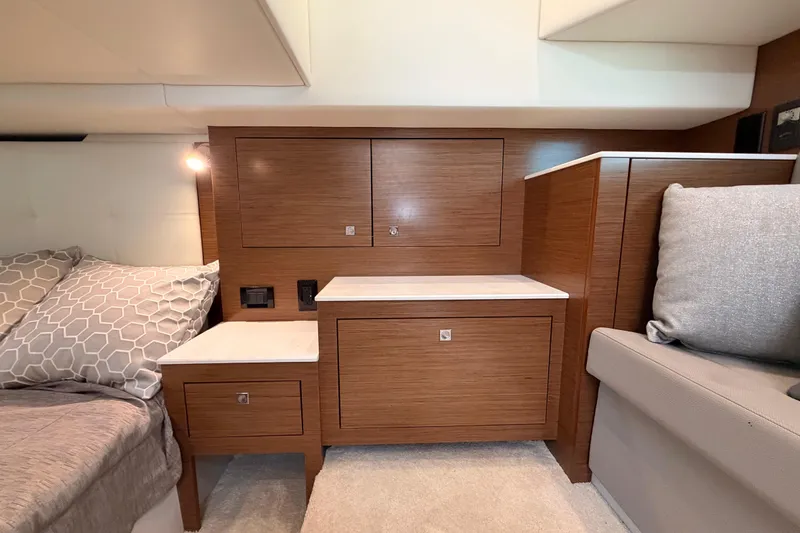 Slide: The Image of 2020 Cruisers Yachts 390 Express Coupe interior with wooden cabinetry and modern design. - 63