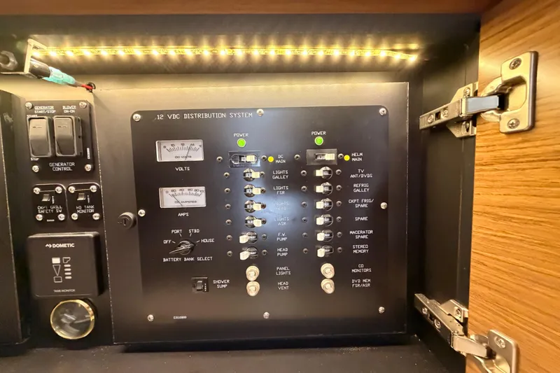 Slide: The Image of Control panel of 2020 Cruisers Yachts 390 Express Coupe with illuminated switches and gauges. - 67