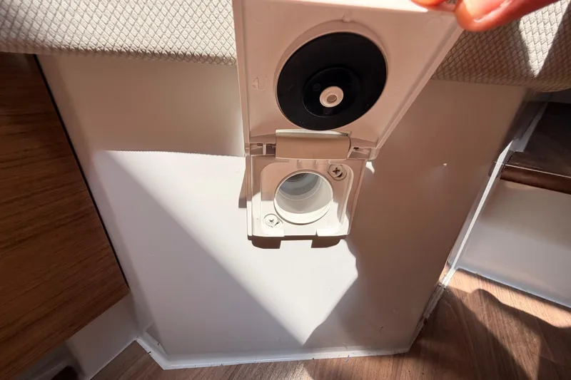 Slide: The Image of 2020 Cruisers Yachts 390 Express Coupe interior detail, showcasing a utility outlet. - 75
