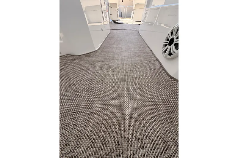 Slide: The Image of 2020 Cruisers Yachts 390 Express Coupe interior with woven flooring and speaker detail. - 77