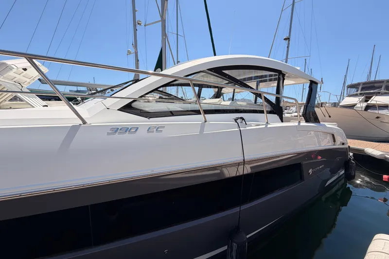 Slide: The Image of 2020 Cruisers Yachts 390 Express Coupe docked at marina under clear blue sky. - 8