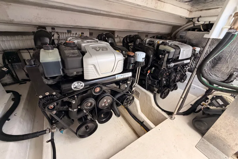 Slide: The Image of Engine compartment of 2020 Cruisers Yachts 390 Express Coupe with dual V8 engines. - 83