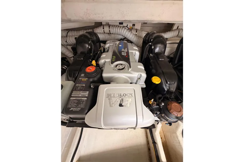 Slide: The Image of Engine compartment of 2020 Cruisers Yachts 390 Express Coupe, featuring a powerful V8 engine. - 84
